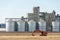 silver silos on agro manufacturing plant for processing drying cleaning and storage of agricultural products, flour, cereals and