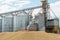 silver silos on agro manufacturing plant for processing drying cleaning and storage of agricultural products, flour, cereals and