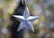 Silver Star Christmas over bokeh blurred background