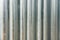 Silver steel metal bar close-up, with unfocused background, industrial concept