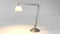 Silver table lamp, electric light on white