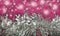 Silver tinsel/garland with pink sparkle background