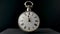 Silver vintage pocket watch with hands running in circle in timelapse video. Old pocket watch with round dial and