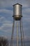 Silver water tower and blue sky