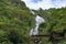 Silver waterfall with arch bridge