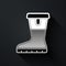 Silver Waterproof rubber boot icon isolated on black background. Gumboots for rainy weather, fishing, gardening. Long