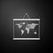 Silver World map on a school blackboard icon isolated on black background. Drawing of map on chalkboard. Long shadow