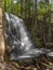 Silverfallet Staircase Waterfall illuminated by low rays of sun