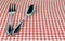 Silverware fork and spoon on tablecloth