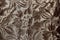 silvery-brown background, fabric,