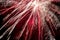 Silvester background with exploding rocket with white stripes and red illuminated background