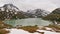 Silvretta reservoir, Motafon, Austria with hotels, dam and the surrounding snow-capped mountains (e.g Piz Buin).