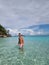 Similan beach Phuket Thailand, youn man walking on the beach in swim short