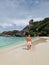 Similan beach Phuket Thailand, youn man walking on the beach in swim short