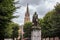 Simon Stevin Bronze Statue in Bruges with park and church as background, Bruges, Belgium, Europe