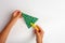 Simple activity for cristmas holiday, kids hand making paper christmas tree