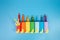 simple activity for kids, toilet paper roll craft, colorful tubes on blue background