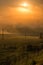 Simple aerial power lines at foggy morning in summer countryside