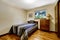 Simple american bedroom with hardwood floor