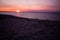 Simple beach and sand landscape with sunset ocean background