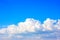 Simple beautiful gloomy blue sky with fluffy clouds in summer morning peace day as a background