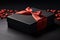 A simple black gift box with a red ribbon surrounded by hearts. Concept for Valentine's Day, birthday and holidays.