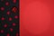A simple black and red background for congratulations with a red bow and hearts, for Valentine`s day or a wedding