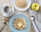 simple Breakfast - tea bags and oatmeal with butter, yellow Apple