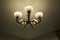 Simple chandelier on a ceiling in a room