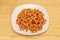 Simple and delicious plate of macaroni with chorizo on white plate