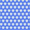 Simple Ditsy fabric pattern of small white daffodils and light blue tulips isolated on a dark blue background