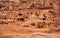 Simple dwelling ruins - cave like holes in stone wall - as seen in Petra, Jordan