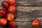 The simple food composition with nectarines on the unique backing closeup