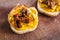 Simple food ingredients, bread slices with sweet potoato and kale dip topped with sundried tomatoes