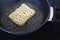 Simple food ingredients, noodles cooking in pan on kitchen stove top