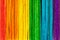 Simple full rainbow backdrop, colorful wooden popsicle sticks backdrop. Abstract multi colored natural background wall texture