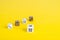 Simple game cubes, dice on bright yellow background. Casino gambling concept