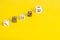 Simple game cubes, dice on bright yellow background. Casino gambling concept