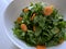 Simple garden salad with carrots and spinach