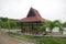 Simple gazebo on the edge of swamp and mangrove forest with green water
