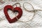 Simple handmade heart on unique cozy background with thread and