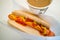 Simple hot dog sandwich with mustard ketchup and coffee