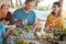 Simple joys of a family Sunday lunch. a family enjoying a meal together at home.