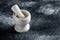 A simple kitchen mortar and pestle. Set of tools to prepare ingredients or substances by crushing and grinding them into a fine