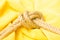 Simple knot on yellow background with esparto rope