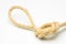 Simple knot on yellow background with esparto rope