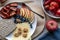 Simple Low carb meal with fiber crispbread, cheese, tomatoes, apples and walnuts on a plate