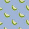 Simple minimalistic seamless pattern with clices forms. Green and light fruit shapes on blue background