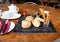 A simple modern looking outdoor cafe meal of bread, olives and sun roasted tomatoes