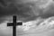 Simple oak catholic cross, storm clouds in the background, space for text